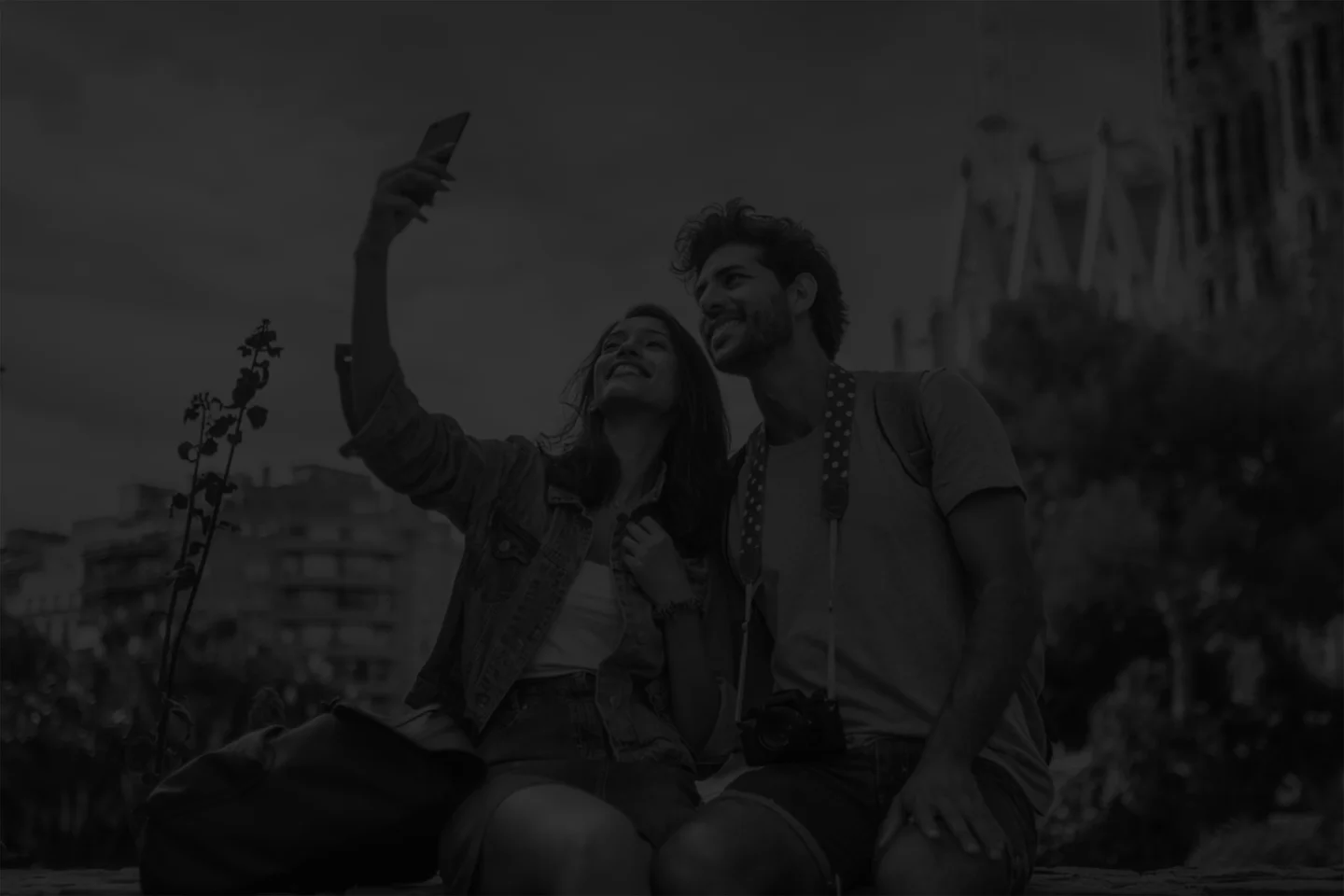 A couple recording a selfie video at a popular tourist destination